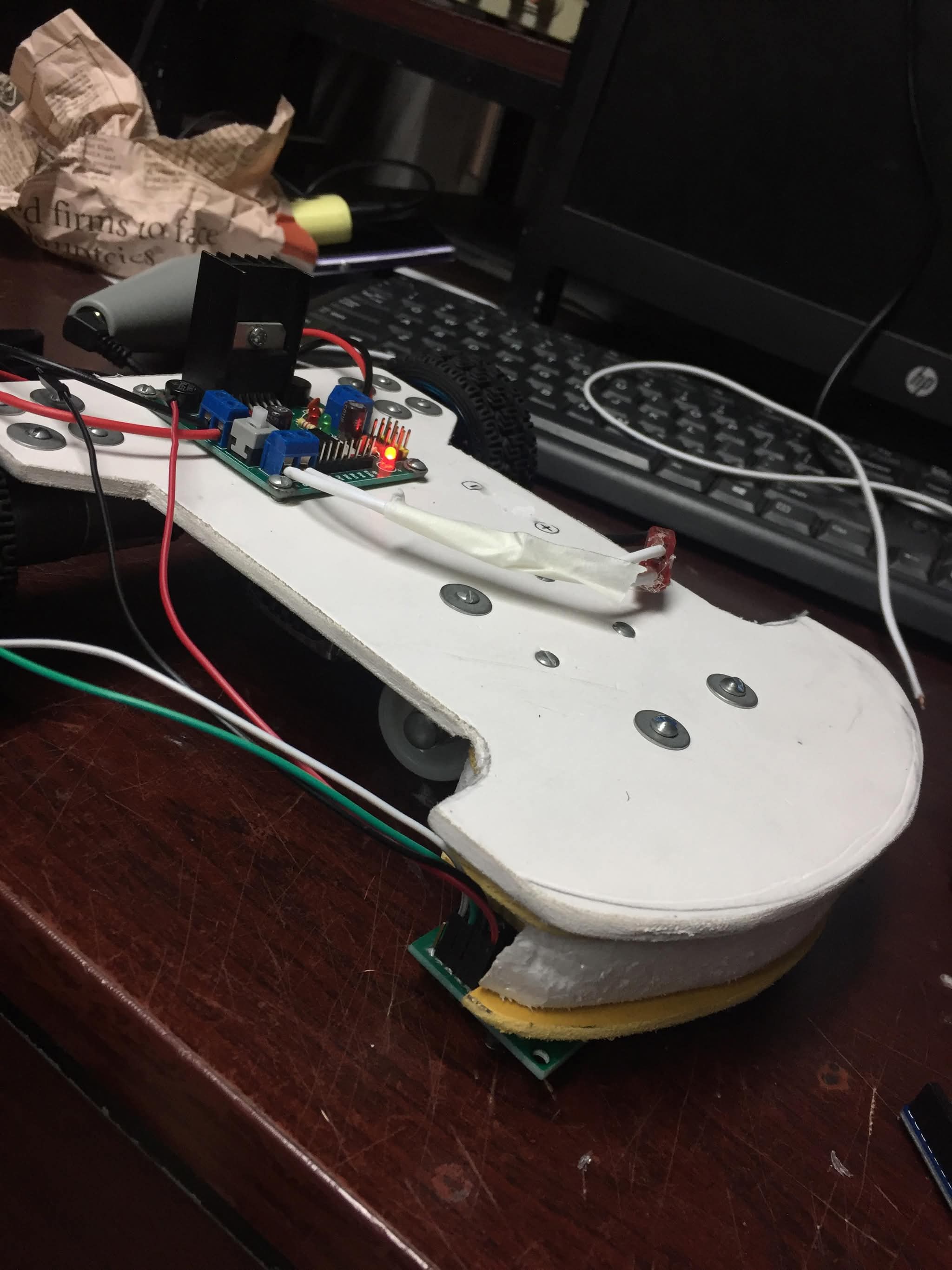 Underside showing the 8-sensor analog array and motor controller