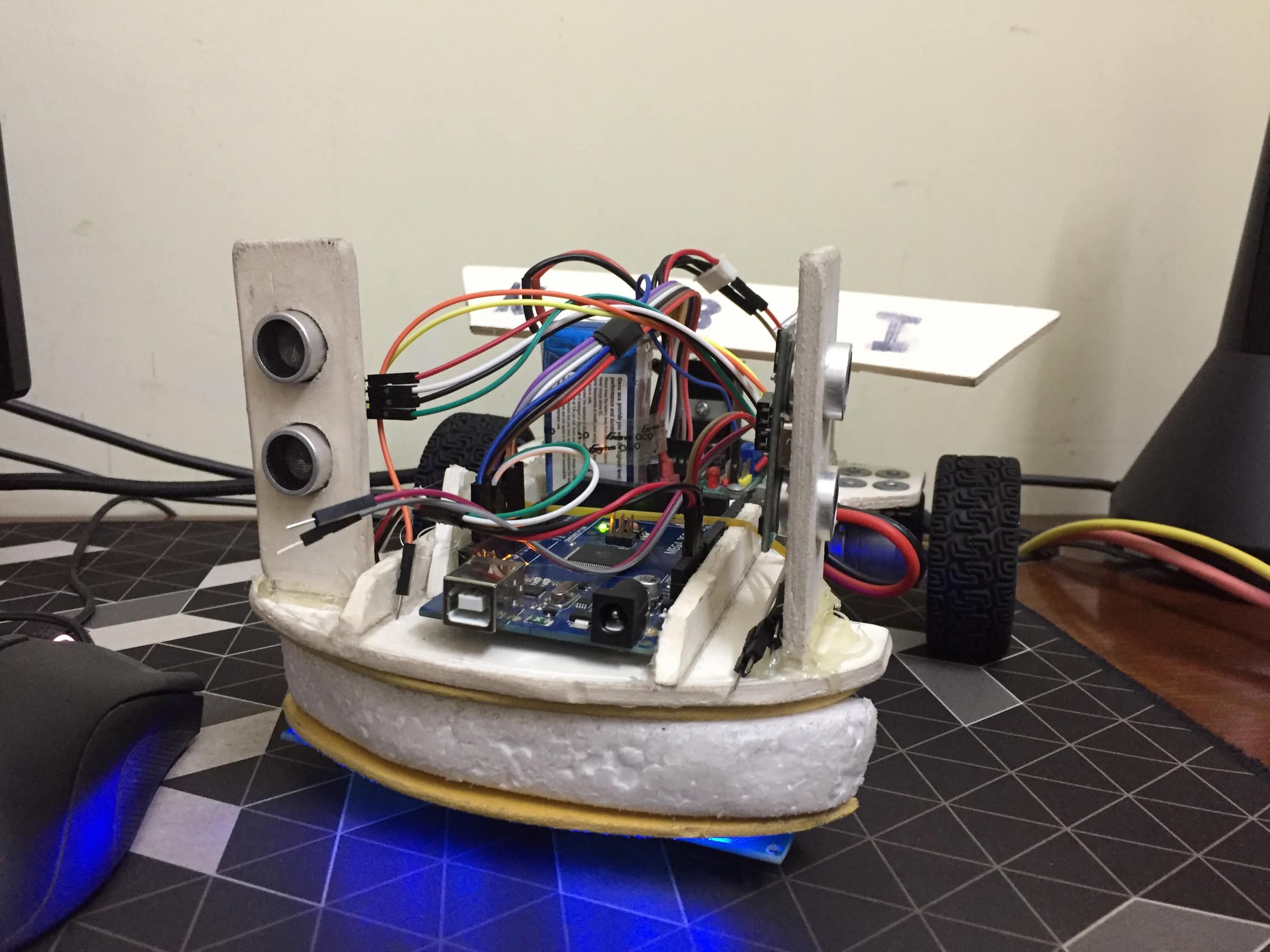 Robot side view showing wheels and wiring